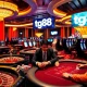 Engaging tg88 casino scene featuring professional poker players and vibrant slot machines.
