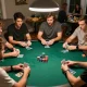 Players strategizing during an engaging poker night, focusing on FC88 gameplay dynamics, with colorful chips and cards visible.