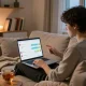 Engaging in a free AI sex chat in a cozy home environment with ambient lighting.