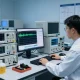 Engineer performing RF testing in a modern lab, showcasing advanced technology and equipment.