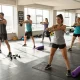 Hitclub fitness community in action with athletes exercising in a vibrant gym setting