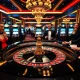 Excited players at https://78winn.co/ celebrating wins at a luxurious roulette table.