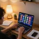 Playing vip79 online casino games on a laptop in a cozy home office