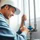 Whole house repiping services St Petersburg FL showcased by a professional plumber at work.