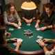 Friends enjoying a fun poker game at home, highlighting ee88go gaming strategies with colorful chips and cards.