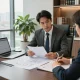Construction lawyer York Region discussing contracts with a client in a modern office.