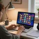 MAY88 online gaming experience with a player engaged in colorful slot gameplay at home.