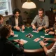 Situs Poker Lapak303 players enjoying poker night, strategizing with friends around a vibrant table.