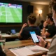 Socolive link displayed on smartphone during live sports betting event, showcasing excitement and engagement