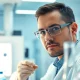Investigating peptide solutions at https://hydroresearchpeptides.com/ in a modern lab setting.