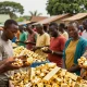 Gold market scene highlighting licensed gold exporters Uganda with miners and buyers engaging in trade.