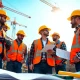 Team of professionals in collaboration at a construction site, emphasizing the importance of construction association.