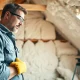 Cost to remove spray foam insulation illustrated by a professional contractor in action.